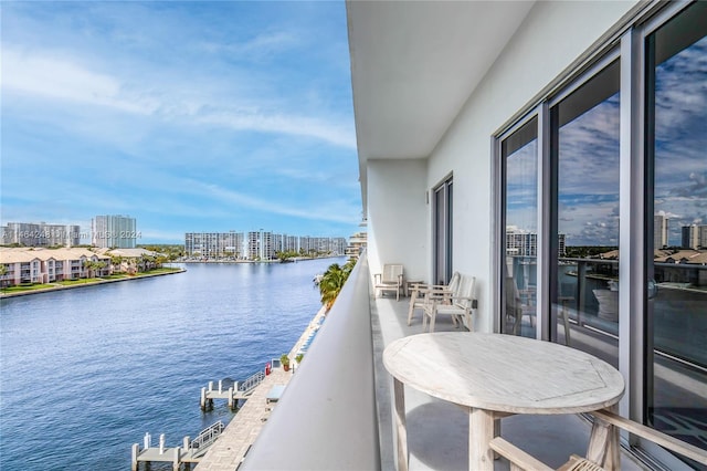 balcony featuring a water view