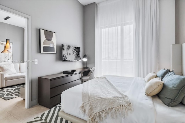 bedroom with light wood-type flooring