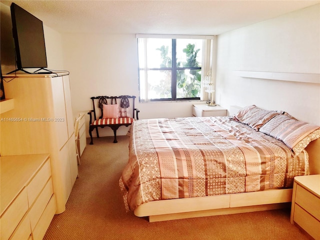 bedroom featuring light colored carpet