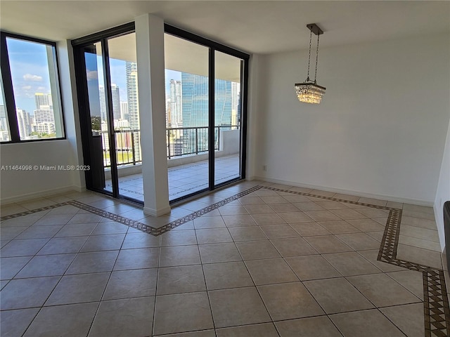 tiled spare room with expansive windows