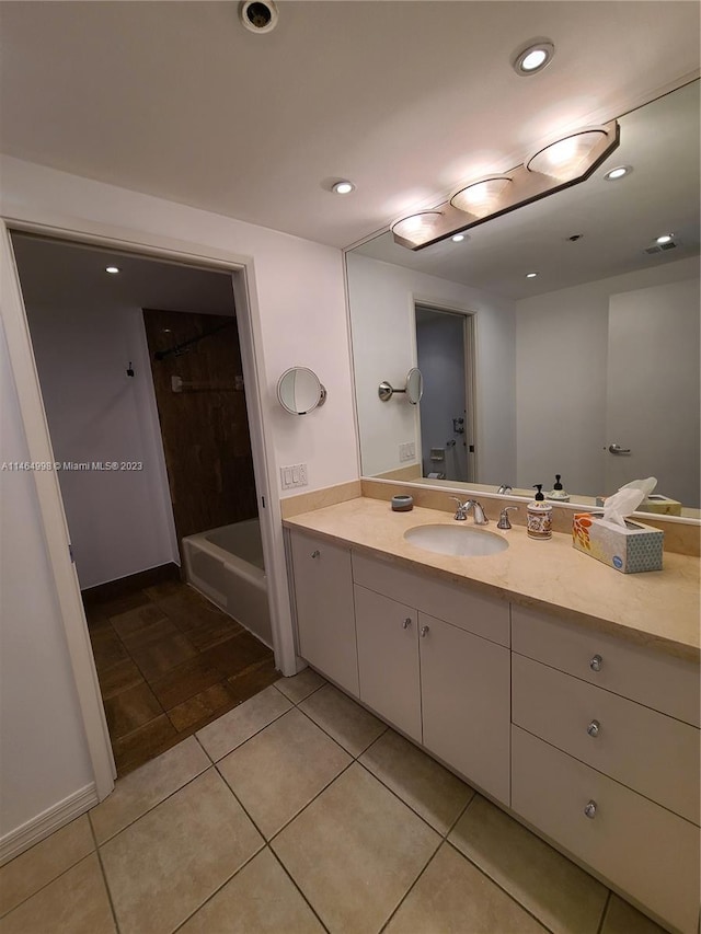 bathroom featuring vanity, tile flooring, and shower / bath combination