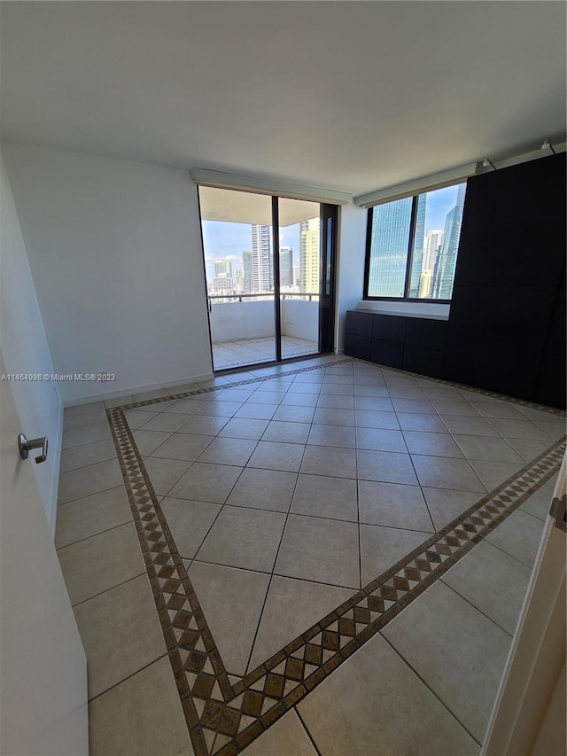 spare room featuring light tile floors