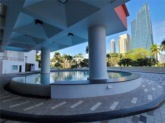 view of swimming pool featuring a patio