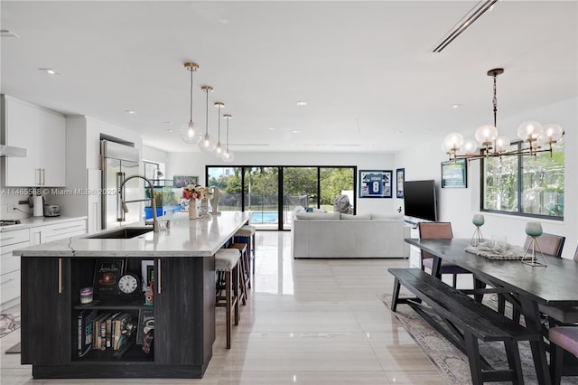 dining room with a chandelier and sink