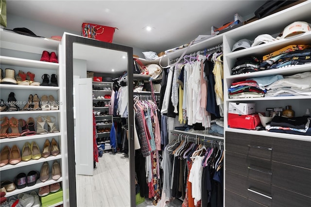 spacious closet featuring light hardwood / wood-style flooring