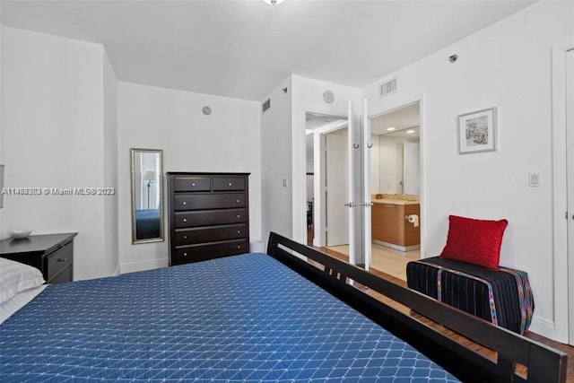 bedroom featuring ensuite bath