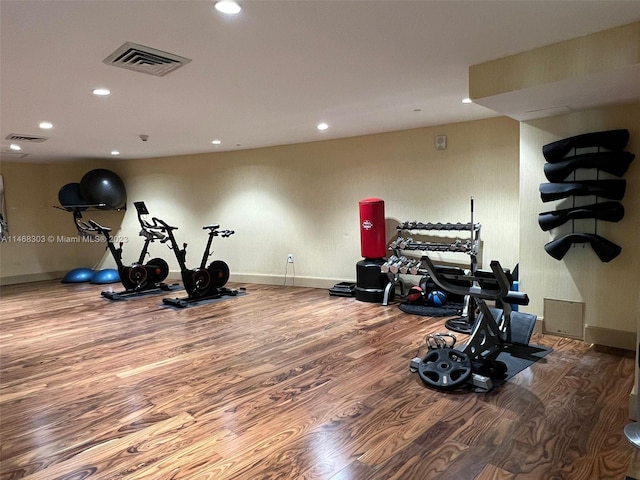 workout room with wood-type flooring