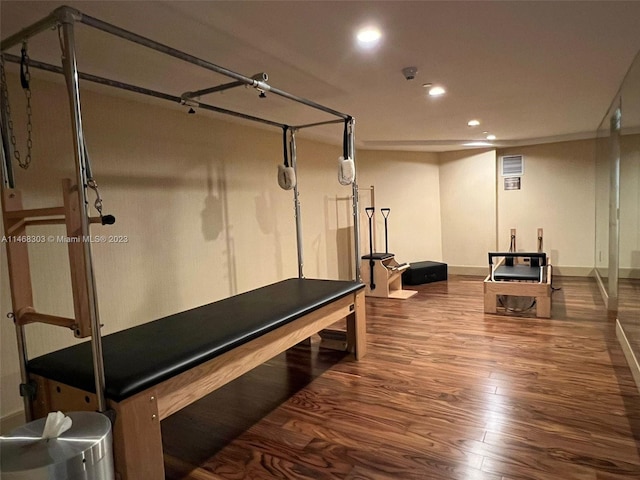 workout room with dark hardwood / wood-style floors