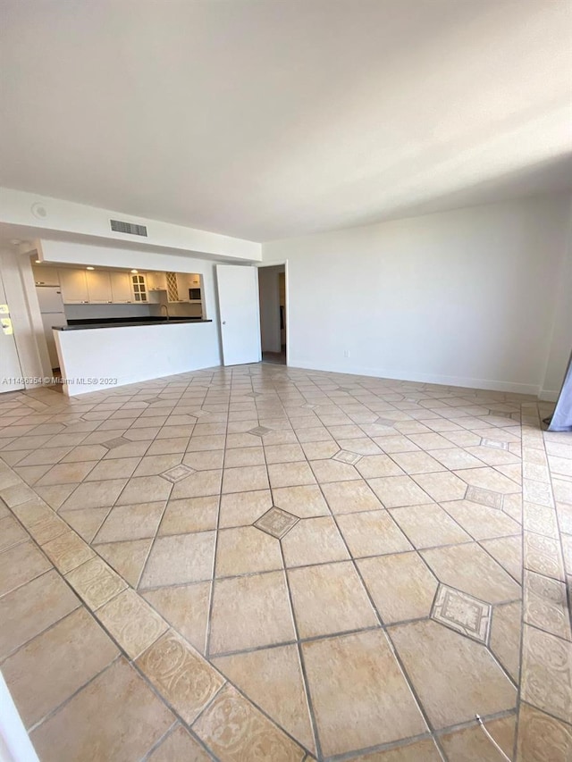 interior space featuring light tile floors