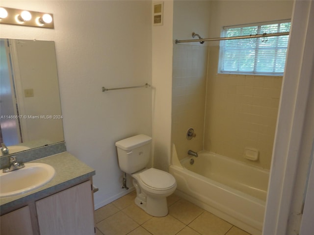 full bathroom with toilet, tile flooring, tiled shower / bath combo, and vanity