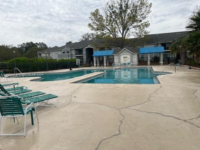 view of swimming pool with a patio