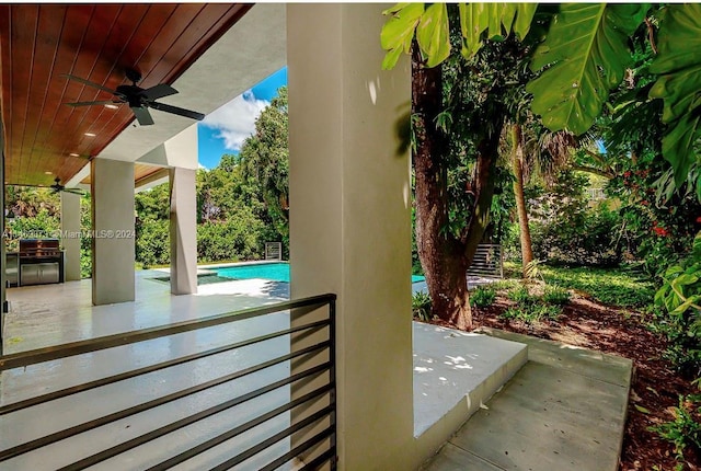 view of patio with a grill and ceiling fan