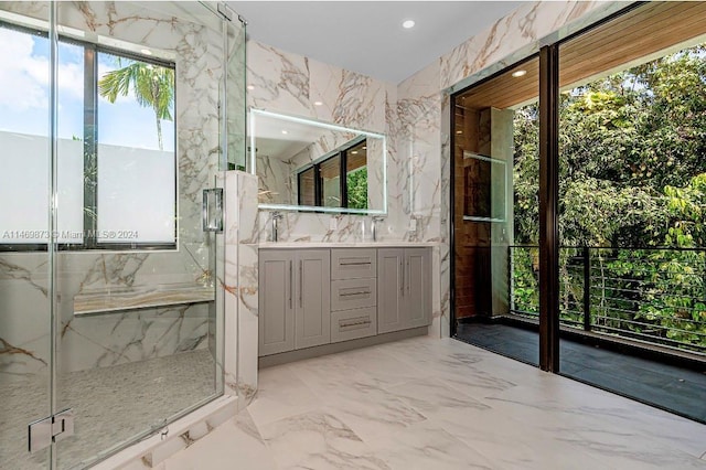 bathroom with vanity and a shower with shower door