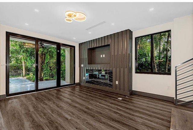 unfurnished living room featuring dark wood-type flooring