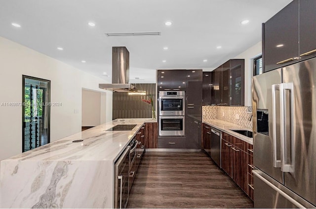 kitchen with stainless steel appliances, dark hardwood / wood-style floors, dark brown cabinetry, light stone countertops, and island exhaust hood