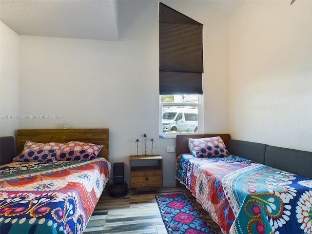 bedroom with hardwood / wood-style floors