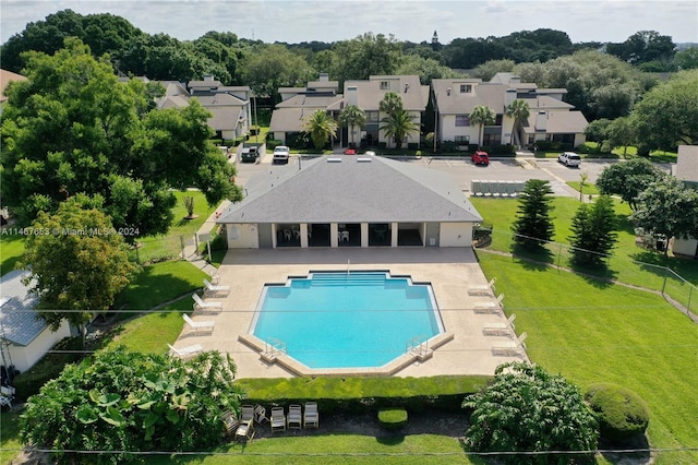 view of pool featuring a yard and a patio area