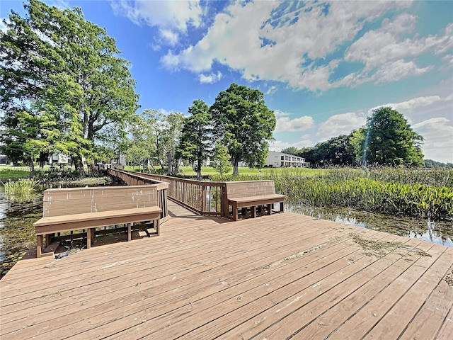 wooden terrace with a water view