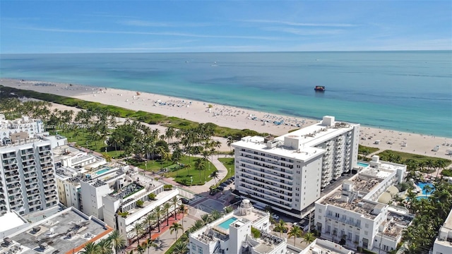 drone / aerial view with a beach view and a water view