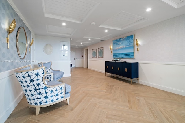 sitting room featuring parquet floors and coffered ceiling