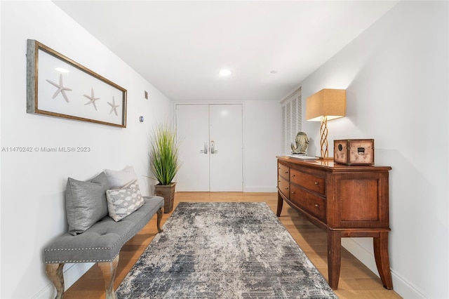 sitting room with light hardwood / wood-style flooring