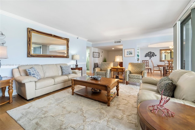 living room featuring hardwood / wood-style floors and ornamental molding