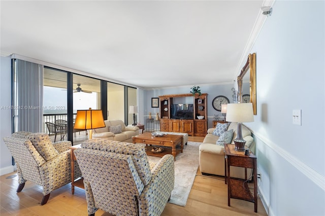 living room with ceiling fan, expansive windows, ornamental molding, and light hardwood / wood-style flooring