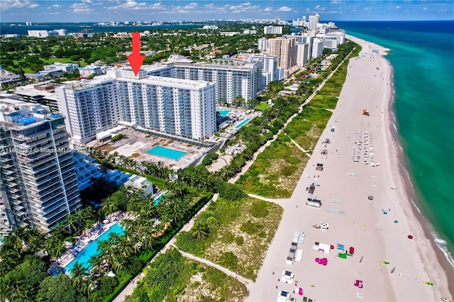 aerial view featuring a water view and a view of the beach