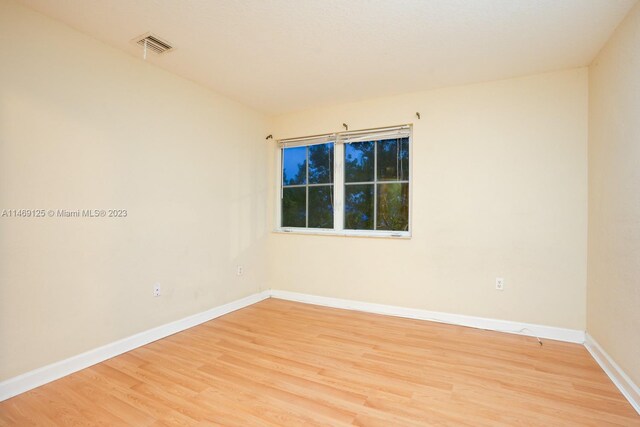 unfurnished room featuring light hardwood / wood-style flooring