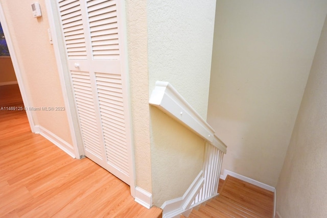 staircase featuring hardwood / wood-style floors