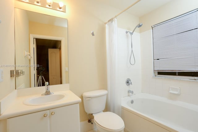 full bathroom featuring vanity, shower / tub combo, and toilet