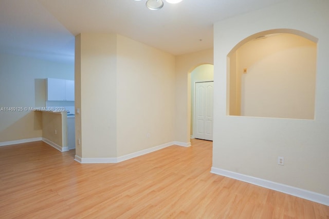 spare room featuring light wood-type flooring