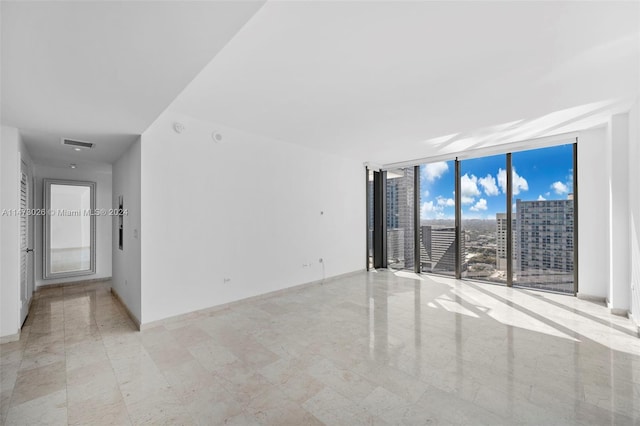 tiled empty room with expansive windows