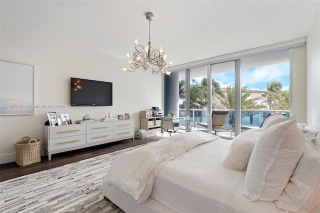 bedroom featuring expansive windows, a notable chandelier, hardwood / wood-style floors, and access to outside