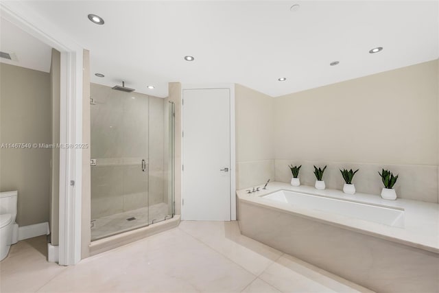 bathroom featuring plus walk in shower and tile patterned flooring