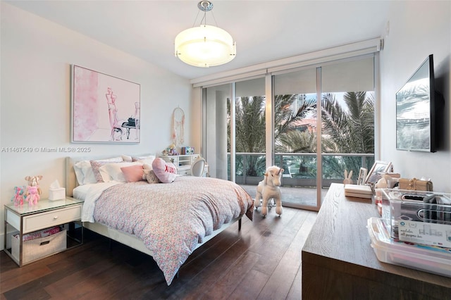 bedroom with multiple windows, dark hardwood / wood-style floors, and floor to ceiling windows