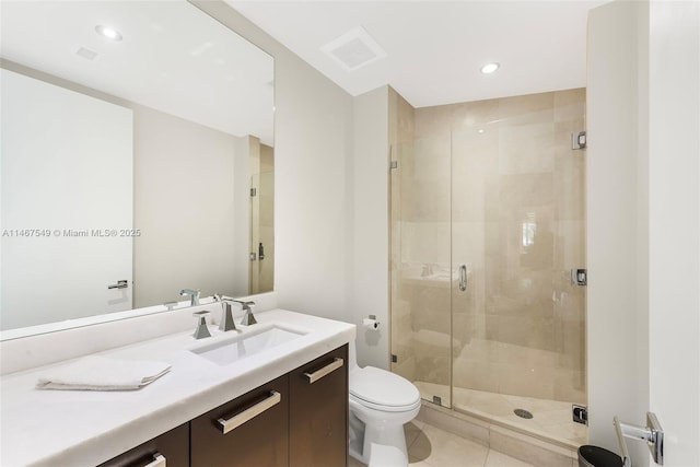 bathroom with walk in shower, vanity, toilet, and tile patterned flooring