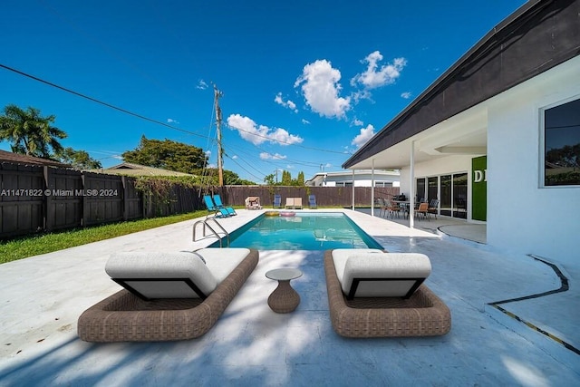 view of pool featuring a patio area