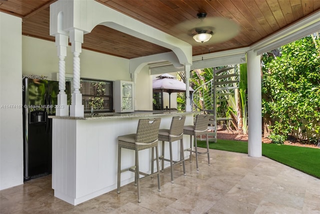 view of patio with a bar