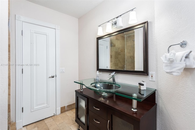 bathroom featuring tile flooring and vanity