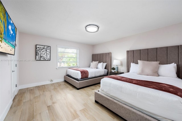 bedroom with light wood-type flooring