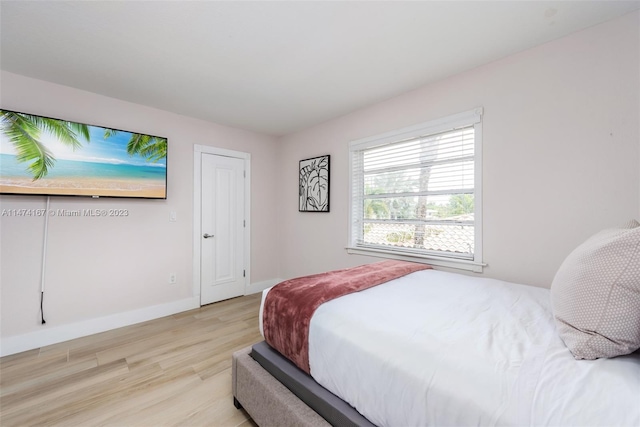bedroom with light hardwood / wood-style floors