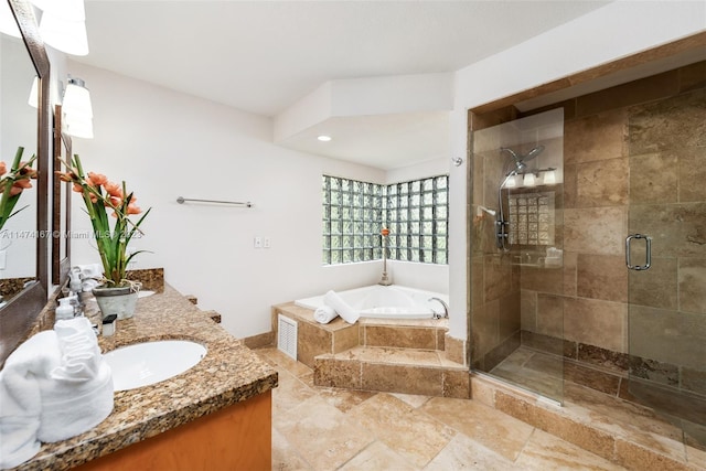 bathroom featuring tile floors, separate shower and tub, and dual vanity