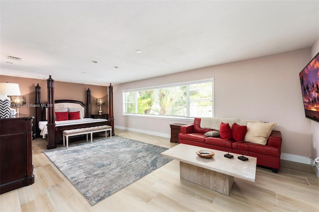 bedroom with light hardwood / wood-style floors