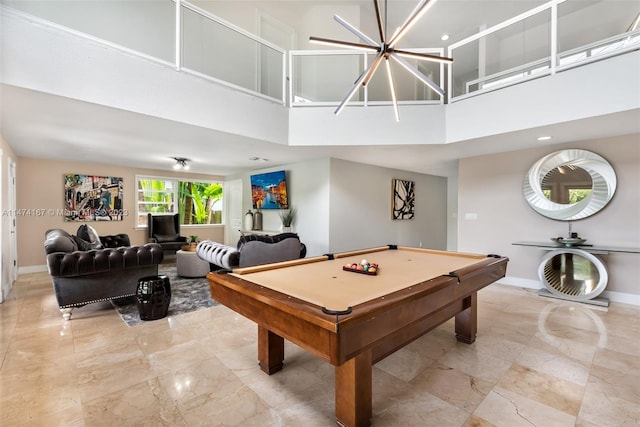 game room with billiards, a towering ceiling, and light tile flooring