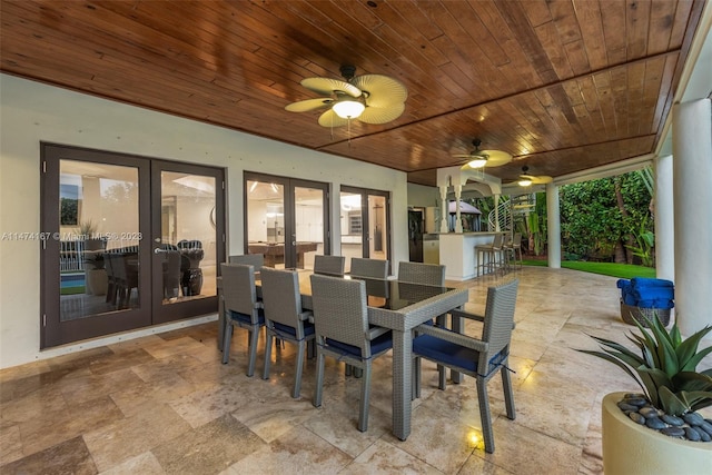 view of patio / terrace featuring ceiling fan and french doors