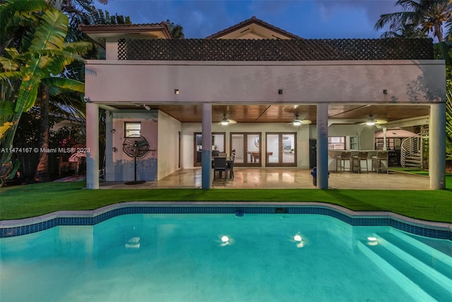 back of house featuring a yard, a patio area, and ceiling fan