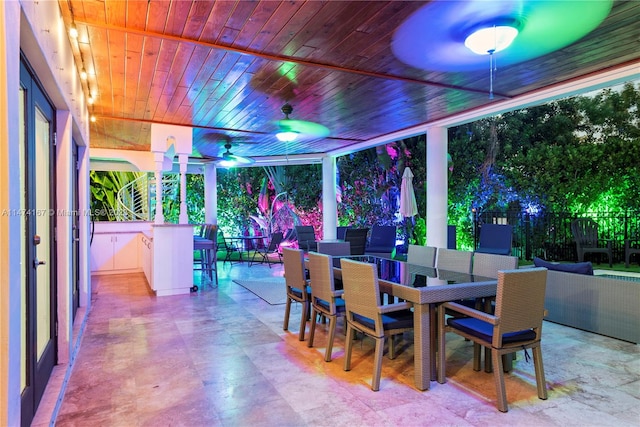 tiled dining space featuring wood ceiling