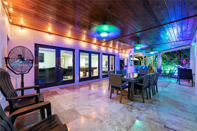 interior space featuring a wealth of natural light, wood ceiling, and french doors
