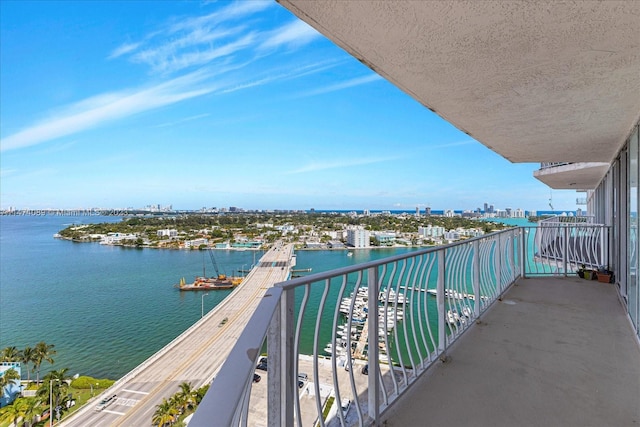 balcony featuring a water view